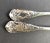 Pair of heavy British sterling silver serving spoons bearing marks for London 1857 and the maker John Samuel Hunt. The...