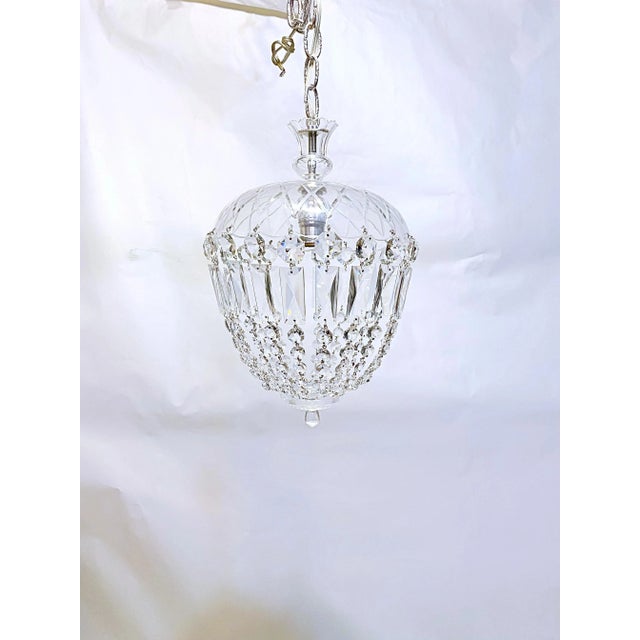 Decorative hand cut basket chandelier with hand cut glass dish frame and 30% leaded A-chain crystals. Rewired and it has...