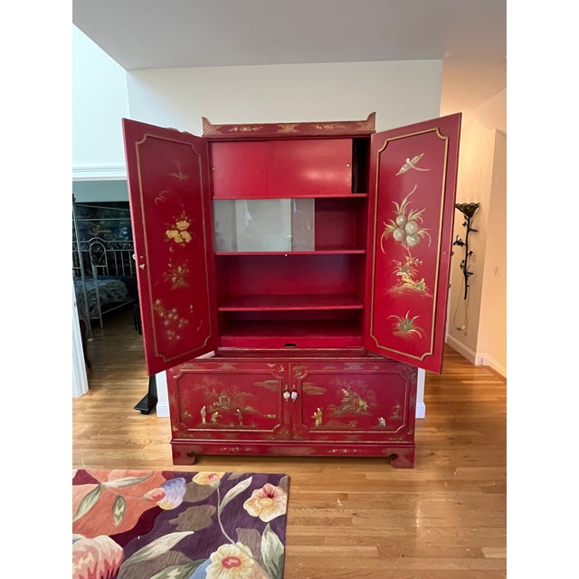 Vintage red lacquered chinoiserie-style piece that blends bold color with elegant Asian-inspired detailing. Finished in a...