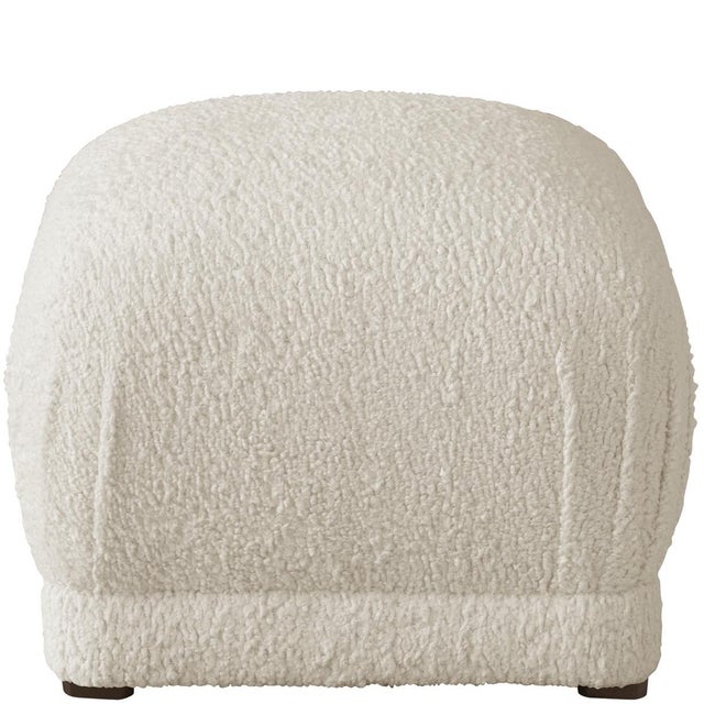 The sleek, fully upholstered design of this ottoman provides a perfect accent piece for any living room environment....