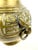 A striking antique Asian brass vase distinguished by its sculptural form and richly aged patina. The rounded body is...