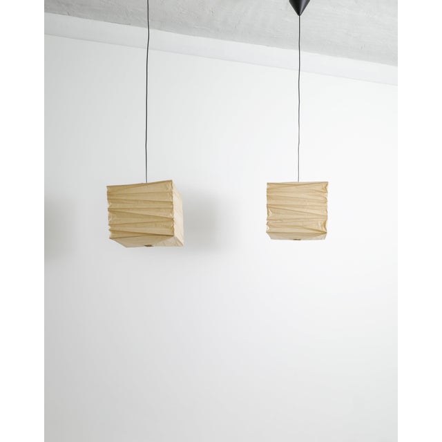 A rare and early pair of mid century squared "33x" ceiling lamp pendants in original washi paper and bamboo by isamu...