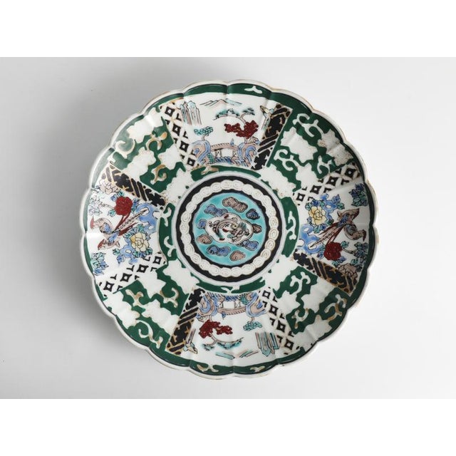 A striking Japanese Imari porcelain charger produced by the Shūhō Kiln in Arita, Japan, dating from the 1970s. Beautifully...