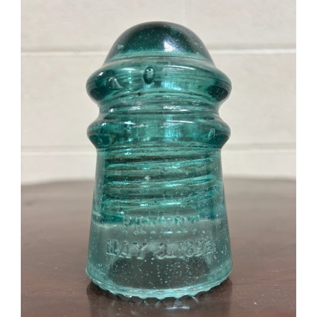 This is a gorgeous aqua or teal vintage glass Hemingray insulator. “Hemingray-No 9.” “Patent May 2, 1893.” Several...