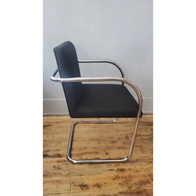 Classic Mid Century Brno Chair, designed by Mies van der Rohe for Gordon International, showcase a stunning polished...