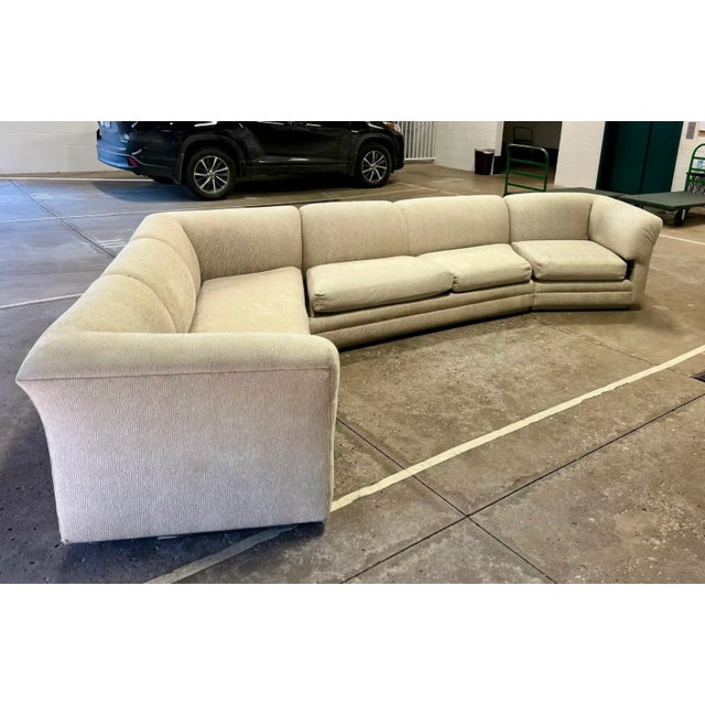 Unique shape statement piece large vintage mid century era 3 piece sectional sofa. It has a recessed chrome paneled base....
