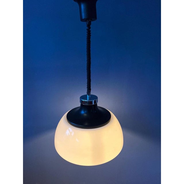 White Massive space age lamp with white acrylic glass shade and black/chrome top cap. The height can easily be adjusted...