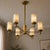 Bring sculptural warmth and natural stone character to the room with this handcrafted brass 6-light chandelier, featuring...