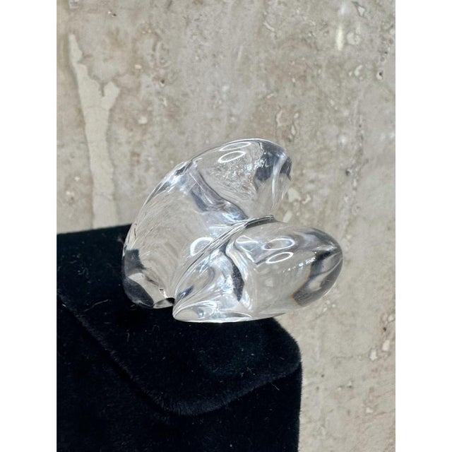 This vintage ring is a bold, sculptural band in water-clear Lucite, shaped as a soft, abstract, heart-like form that...