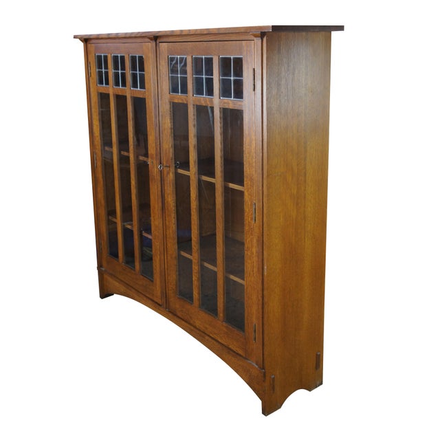 Vintage Stickley Mission style quartersawn oak two door double bookcase curio cabinet. Stickley 89-704, This beautiful...