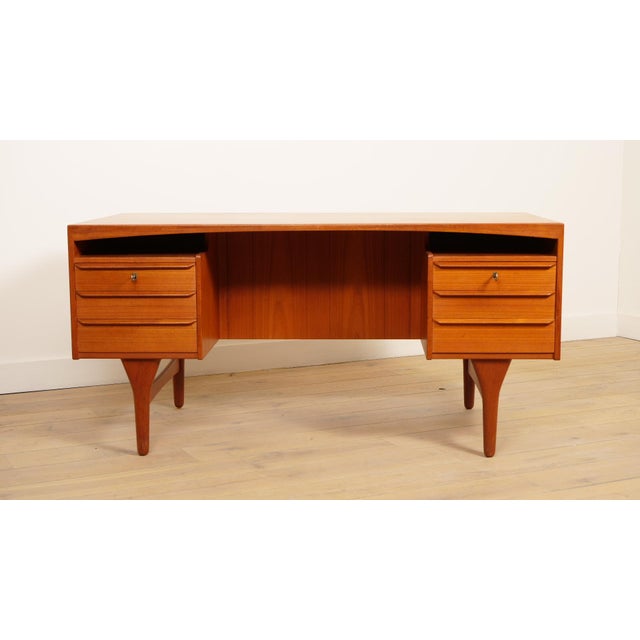 Designed by Valdemar Mortensen, this stylish desk was manufactured in Denmark in the 1960s. It is made of teak and...