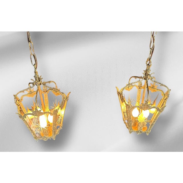 These European Mid Century pendant lights are incredibly classy! They each have three new porcelain candelabra sockets...