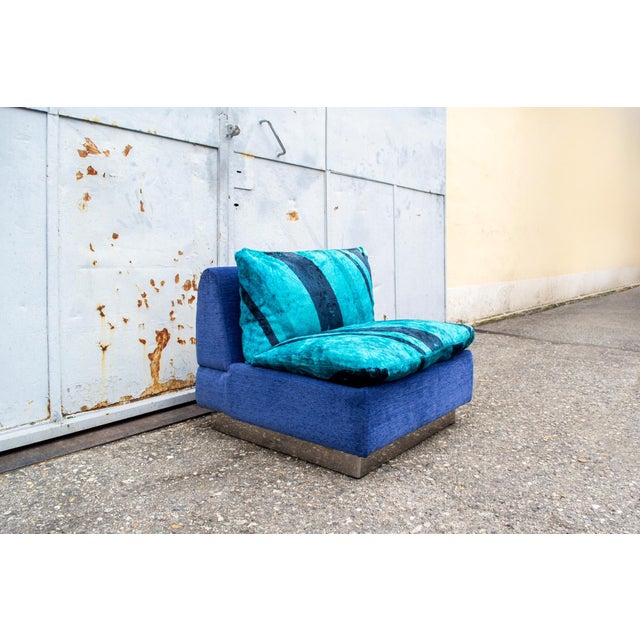 Armchair with wooden structure, padding covered in fabric, steel details. Kentia model Designer Ernesto Radaelli Producer...