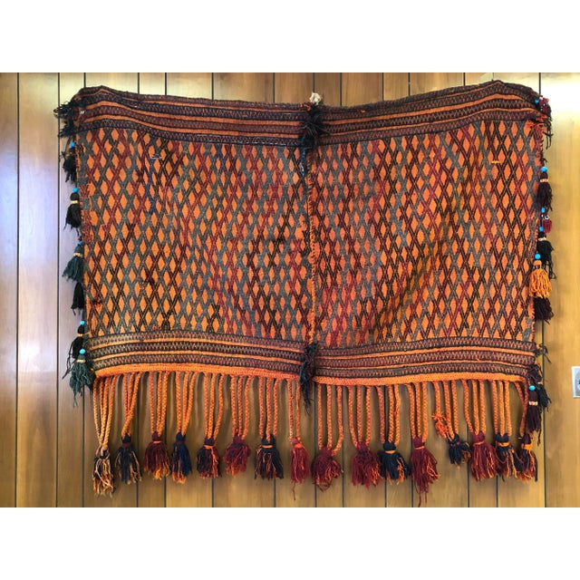 Made in Morocco, this handwoven rug has vibrant colours, hand made ceramic beads, plenty of tassels, braiding and...