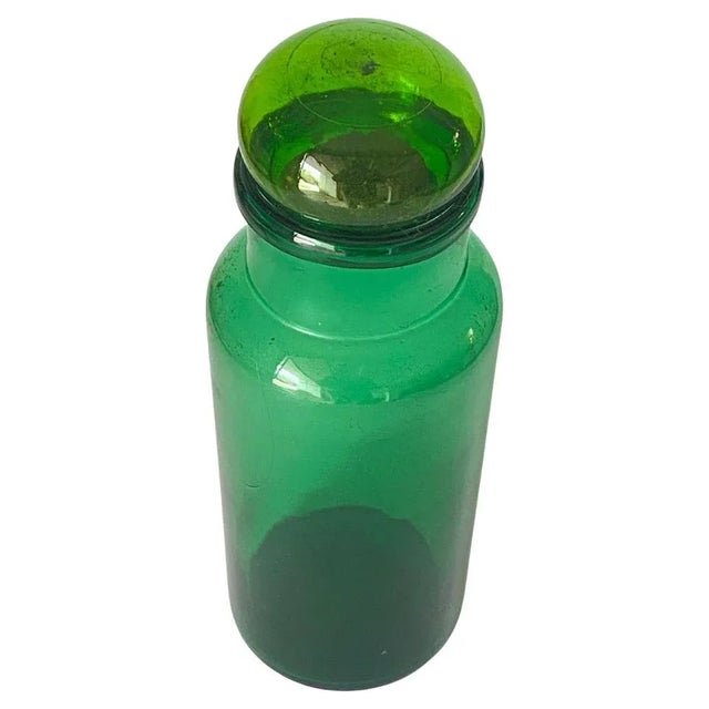 This glass decorative bottle, has been made in Italy in the 1970s.