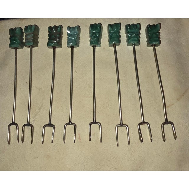 Nice set of vintage silver and carved onyx cocktail olive forks.