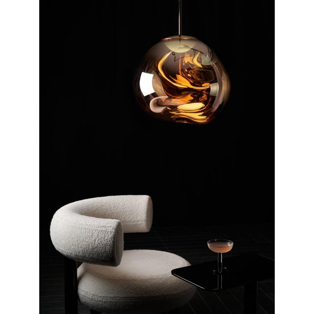A striking, sculptural pendant with Tom Dixon’s signature “melted glass” look. This 50mm gold Melt features an integrated...