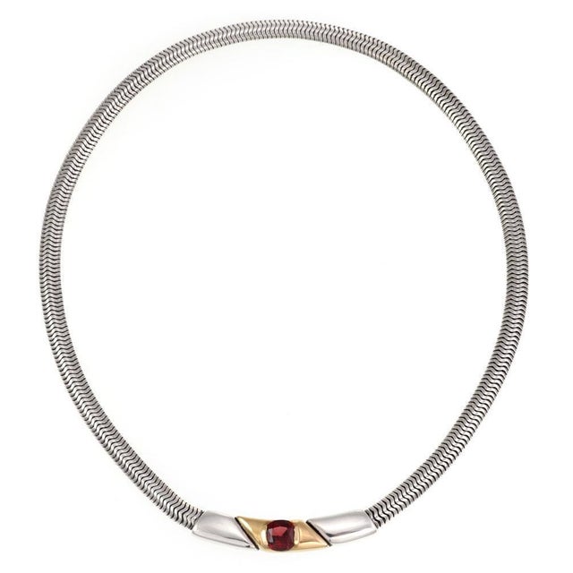 This is an authetic vintage necklace by Gucci, it is crafted from sterling silver with 18k yellow gold accent. The pendant...
