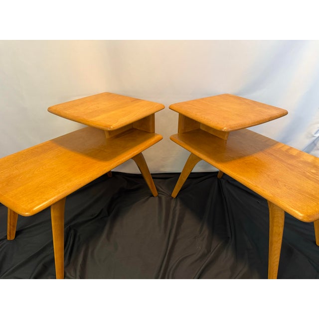A beautifully preserved matched pair of authentic vintage MCM Heywood-Wakefield step end tables M-308-G in the company’s...
