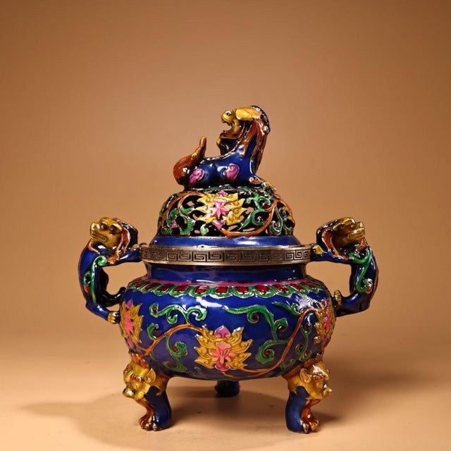 This is a finely crafted antique cloisonné enamel censer (incense burner), featuring a rounded, tripod form. The body is...
