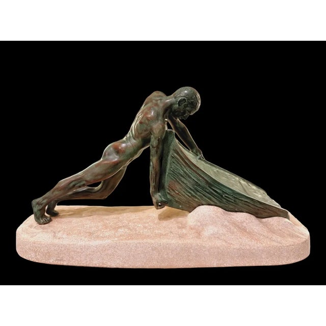 Max Le Verrier, Art Deco Nude Male Figure Pushing a Boat, 1930s, Metal, in Flawless conditions. Designed 1920 to 1949 This...