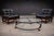 A refined circular coffee table from 1960s Brazil, executed in plated and painted metal with a new glass top. The two-tier...