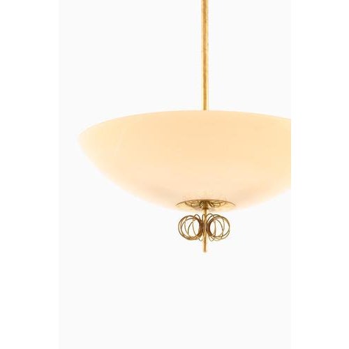 This exceptionally rare ceiling lamp was designed by the renowned finnish designer paavo tynell and produced by taito oy...