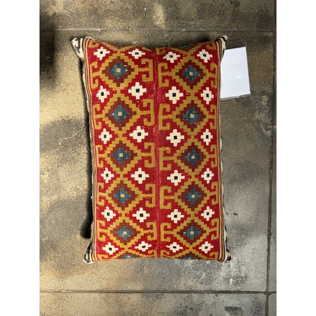 Bring centuries of textile tradition into your home with this vivid 19th century Caucasian kilim pillow, showcasing...