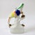 This charming mid-19th-century Staffordshire pottery figural quill holder depicts a vibrant parrot perched atop a mossy...