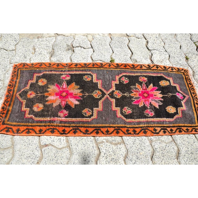 This is a vintage Turkish Oushak rug from the 1960s. The piece was hand-knotted.