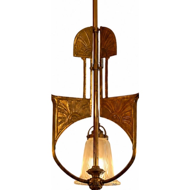 Austrian Vienna Secession / Jugendstil chandelier dating from circa 1910–1920. The design combines sculptural brass...