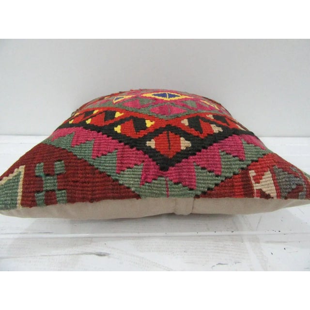 This is a pillow cover made from a vintage kilim rug. The piece was properly washed and ready to use. Pillow inserts not...