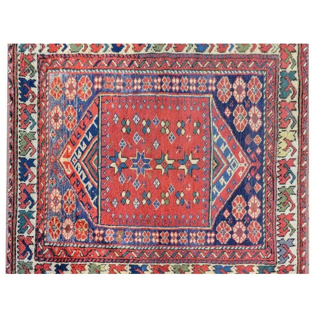 A sweet early 20th century Turkish Sparta rug with a wonderful tribal pattern containing stylized flowers woven in indigo,...