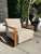 This chair is in the style of a Mid-Century chair, but is not vintage. The fabric has a mixture of neutral colors and a...