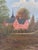 This original vintage oil painting, created around 1930, shows a large manor house beside a lake, surrounded by trees and...