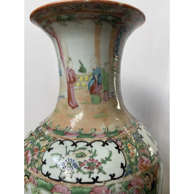 An exquisite antique Rose Medallion shouldered vase from late 19th-century China, showcasing the artistry and elegance of...
