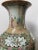 An exquisite antique Rose Medallion shouldered vase from late 19th-century China, showcasing the artistry and elegance of...