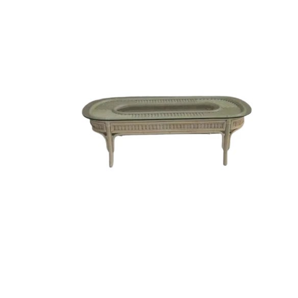 The Wash Wood Bamboo Coffee Table Glass Top features a bamboo material construction with a glass tabletop. The coffee...