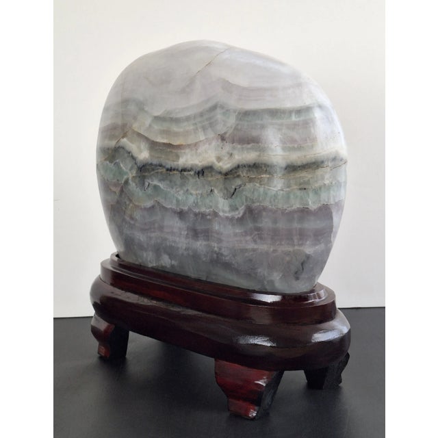 Massive Chinese flourite gongshi, an ovoid shape, translucid, viewing stone with stratified, chrystalline layers in greys,...