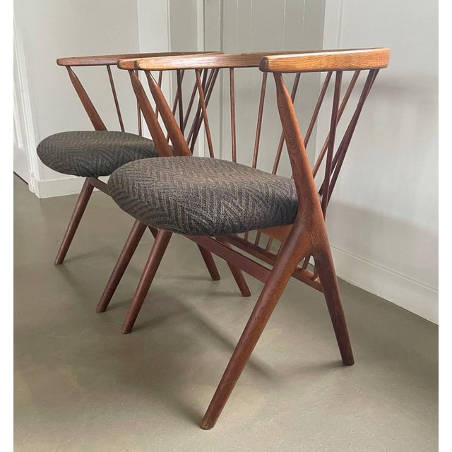 Beautiful set of chairs with armrests and striking backrest with spindles, desiged by Helge Sibast for Sibast, Denmark,...