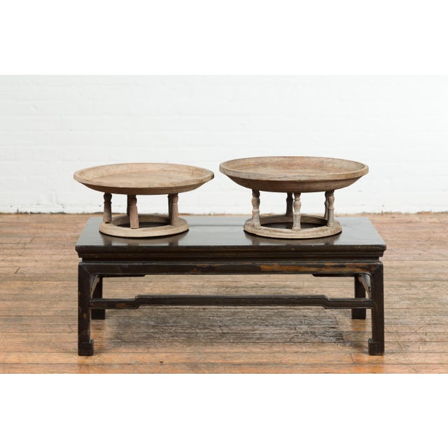 A Thai round offering tray used to display food in front of the Buddha, with spindles and natural rubbed patina. We...