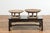 A Thai round offering tray used to display food in front of the Buddha, with spindles and natural rubbed patina. We...