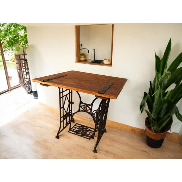 This extraordinary industrial table unites two original historical elements into a unique piece of furniture: the cast-...