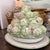 A charming Italian ceramic artichoke tureen and matching underplate, beautifully sculpted as a basket overflowing with...