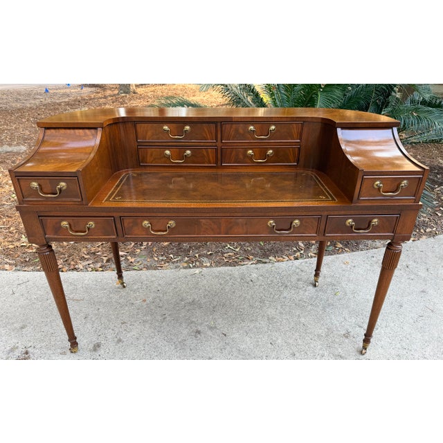 Flame mahogany carlton house desk. Good quality example of this popular desk design. Freestanding with shaped back and...