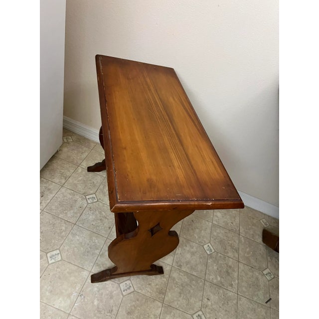 Antique side table with book trough. Great size for a small reading corner/nook. Measuring 27” x 12.75” and 24” tall. The...