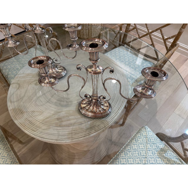 An exceptional, fine and impressive pair of antique Victorian English sterling silver lyre candlesticks. These exceptional...