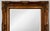 A large, substantial gilt mirror with a solid wood frame base and ornately detailed composition ornament — raised...