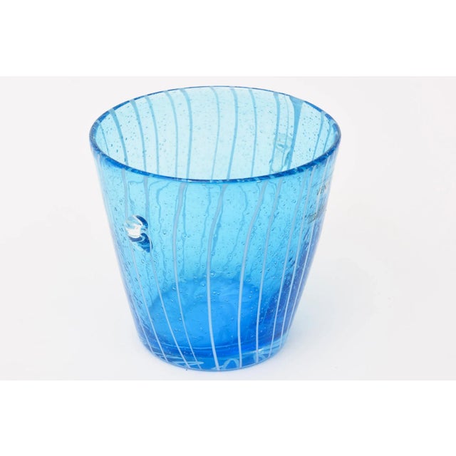 This Italian Murano Venini vintage glass ice bucket has white uneven lines with against the sapphire blue background. The...