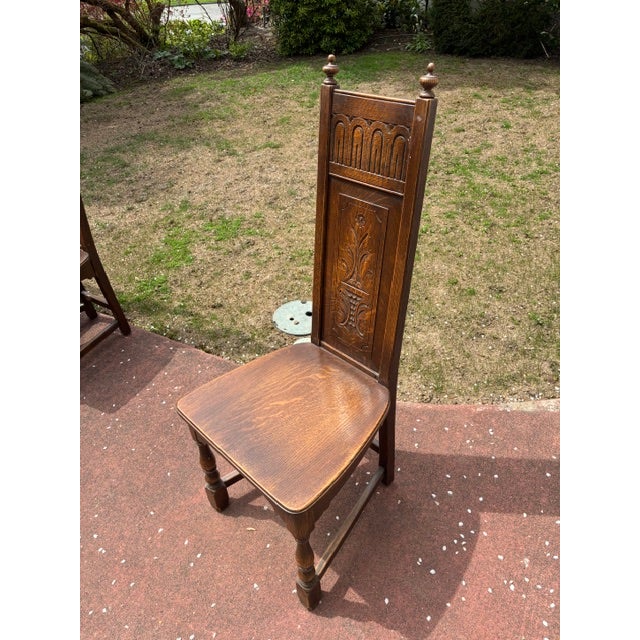 Beautiful solid wood oak 1930's dining chairs in Greek Revival style. One arm chair and five side chairs make up this...